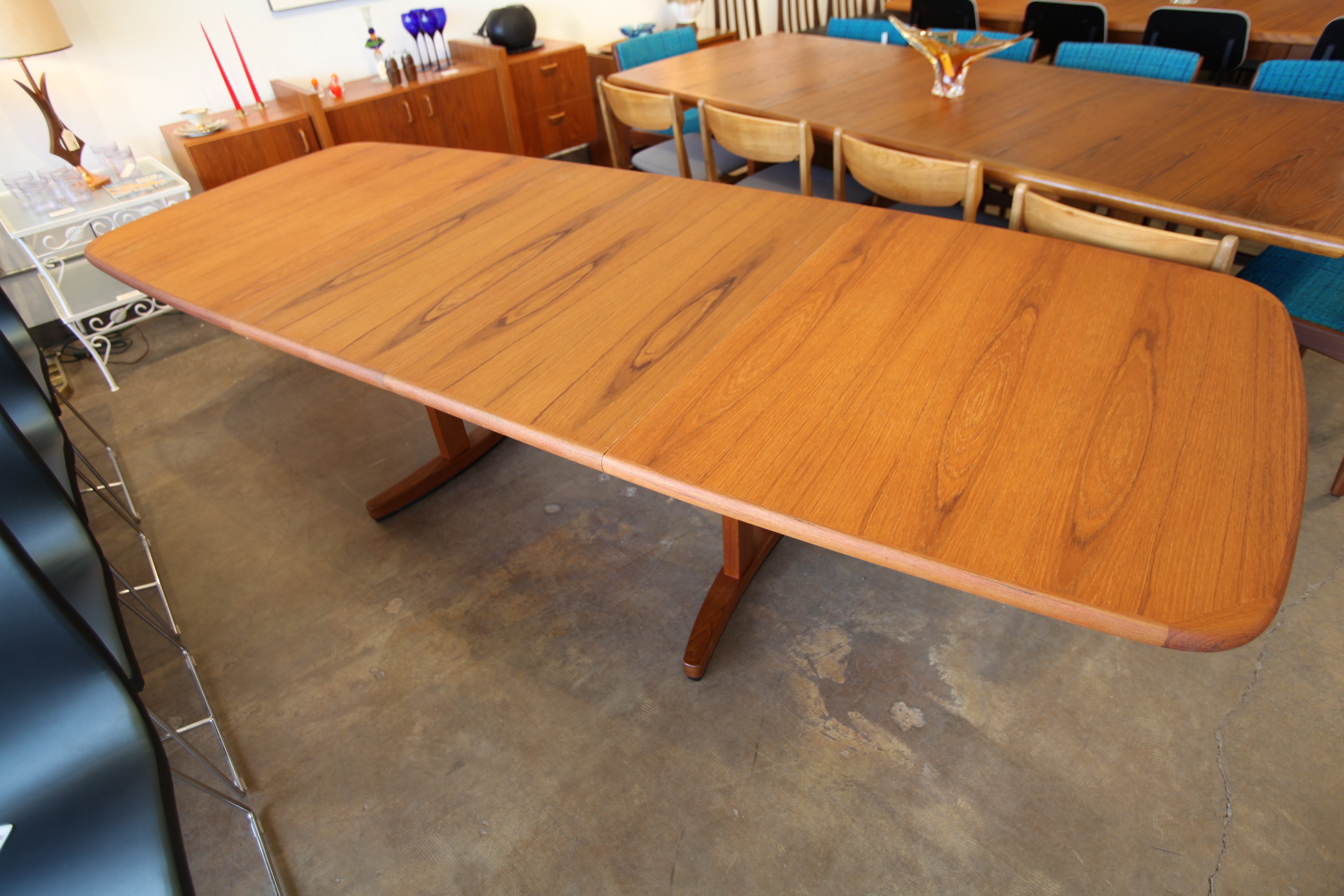 Long Vintage Teak Dining Table w/ 2 Leafs and mechanical assisted leaf opening
