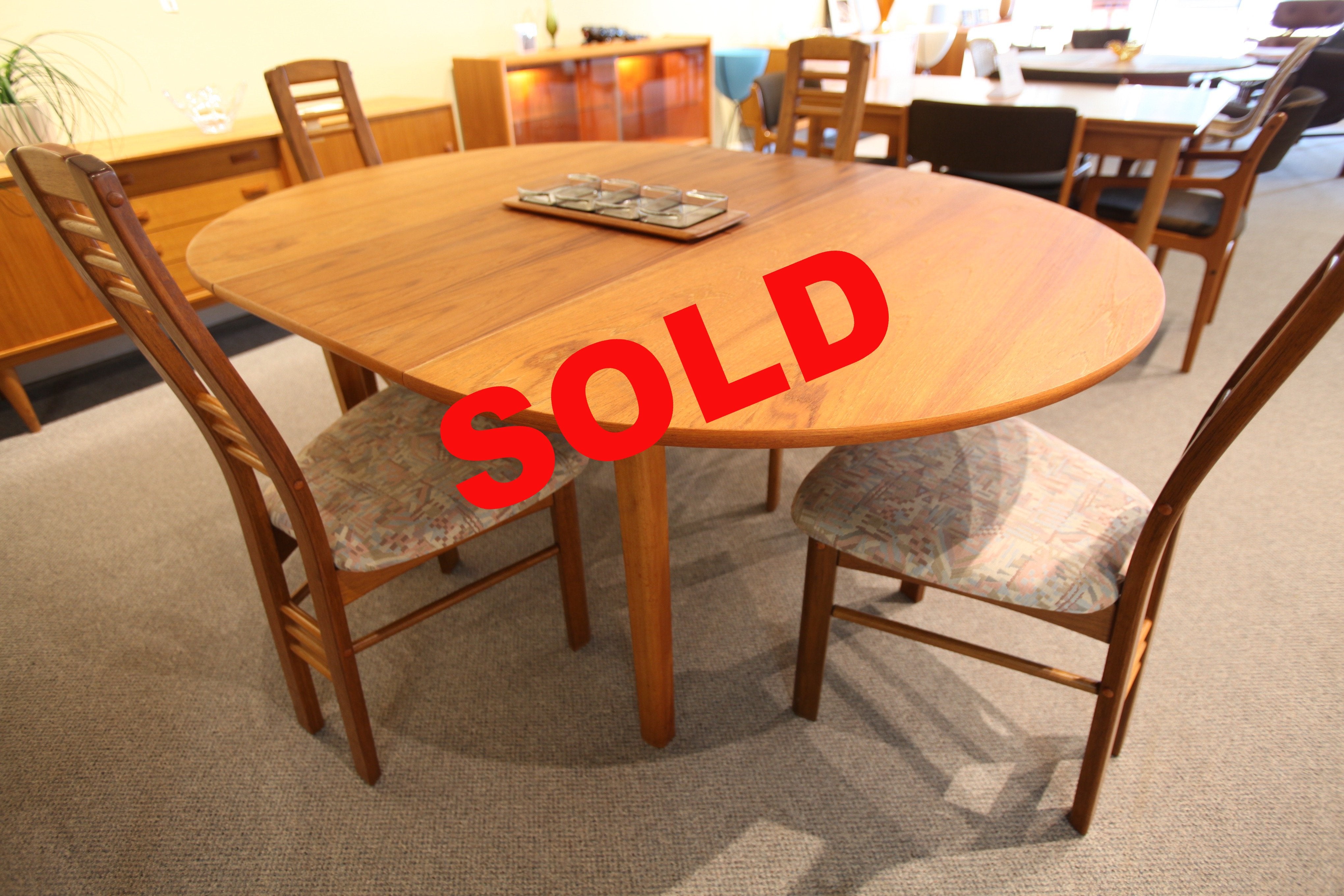 Round Teak Table with Butterfly Leaf (66.75" x 47") or (47" x 47")