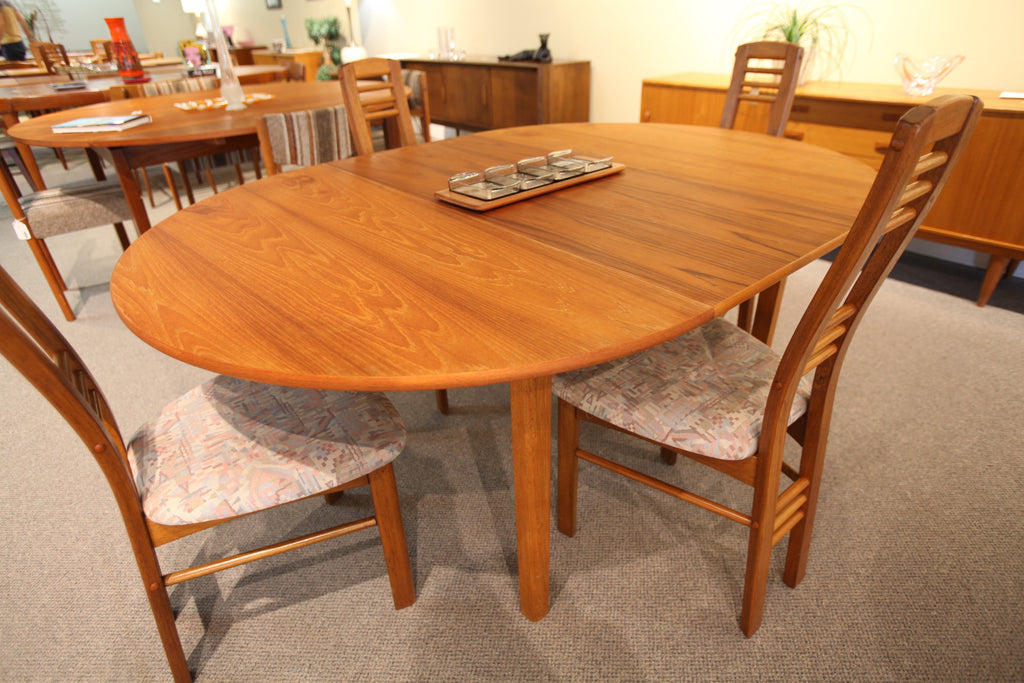 Round Teak Table with Butterfly Leaf (66.75" x 47") or (47" x 47")