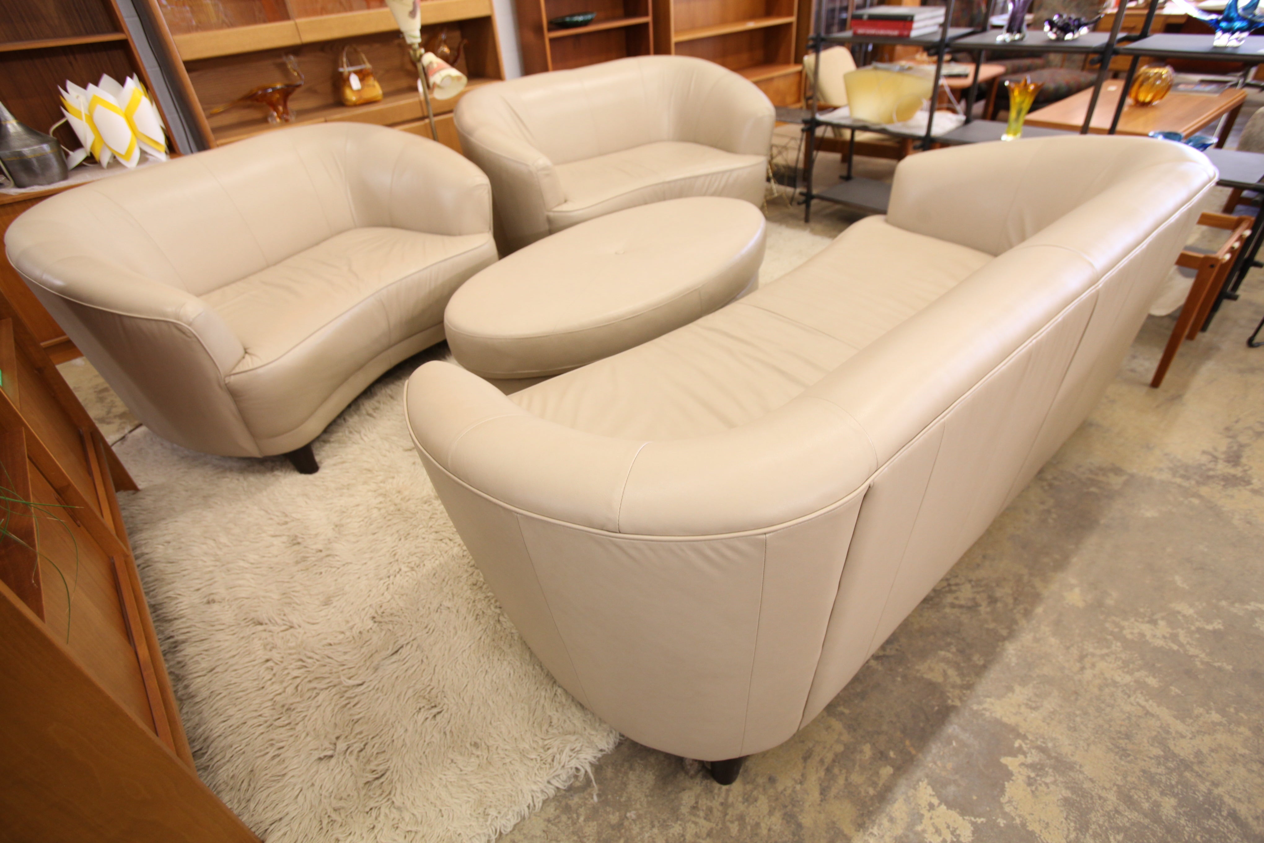 Oval Ottoman in Beige Leather (53" x 29" x 17"H)